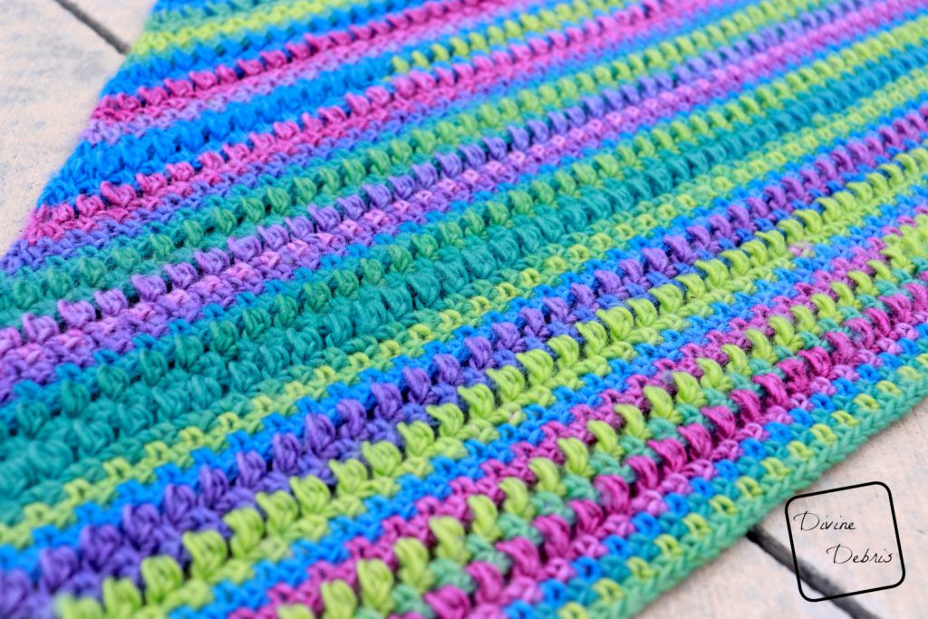 Learn to make the Whitney Shawl, an easy crochet shawl design that works wonderfully in one or more colors, from a free crochet pattern on DivineDebris.com