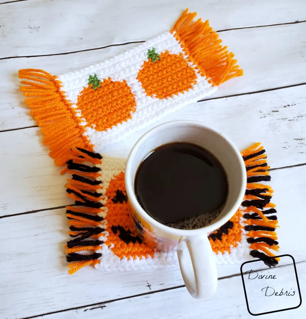 Learn to make the Cute Pumpkins Mug Rugs from 2 free tapestry crochet patterns by DivineDebris.com
