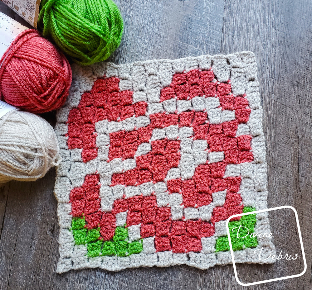 [image description] Rose Afghan Square crochet pattern with 3 skeins of yarn in the top left corner.
