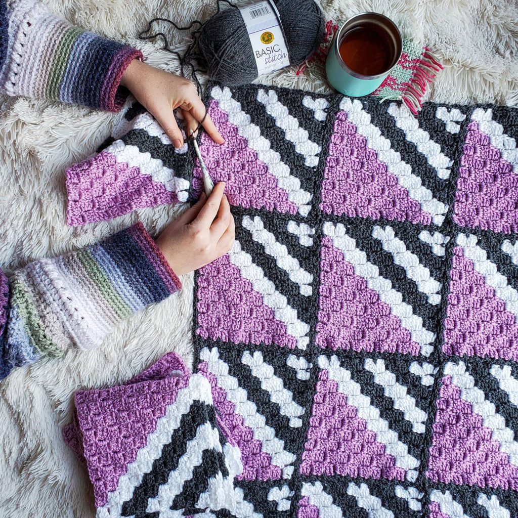 Learn to make the fun, easy, and delightfully customizable C2C blanket, the Neapolitan Blanket, from a free crochet pattern by Divine Debris