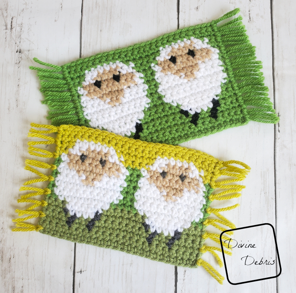 [image description] Two of the sheep mug rugs, rectangular coasters of a white sheep on a green background lay on top of each other. The Dancing Sheep Mug Rug 