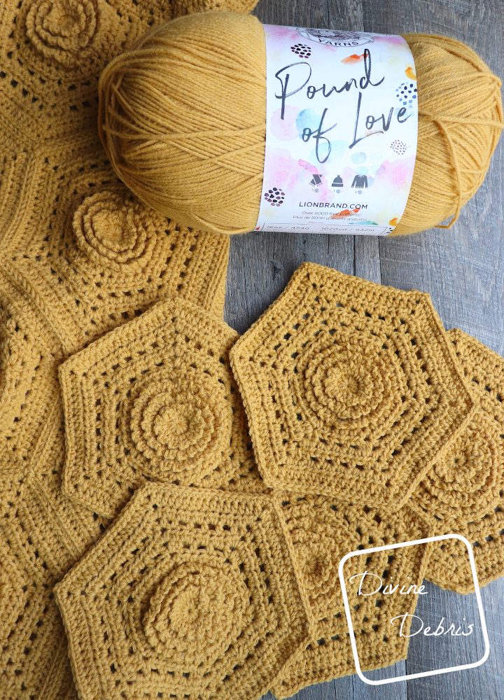 [Image description] Top down view of a skein of Lion Brand yarns Pound of love in Maize and the Florence Hexagon Blanket hexagons made in the yarn on a wood grain background.