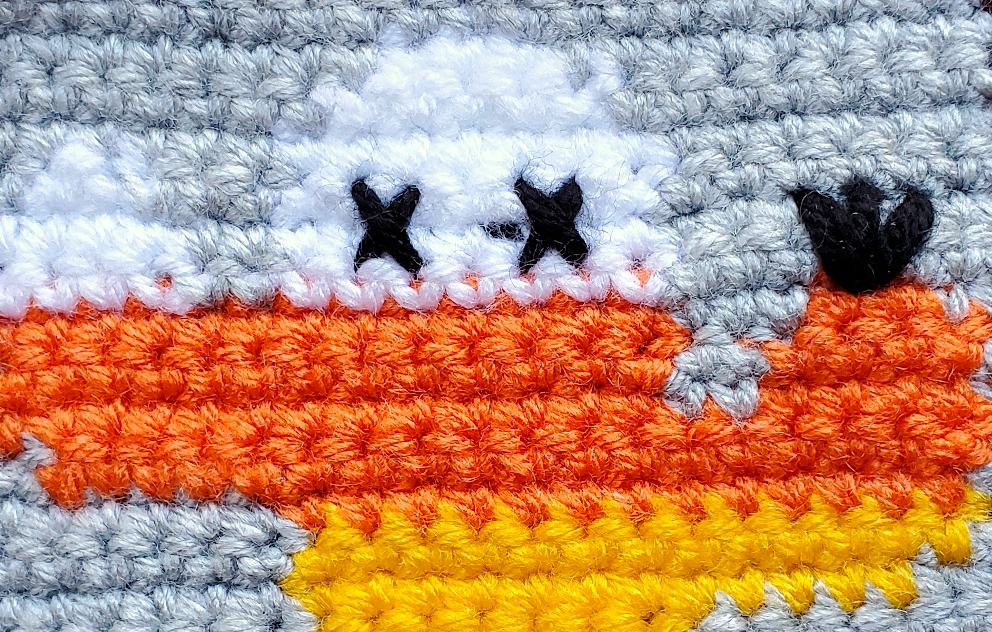 [Image description] Close up of the Candy Corn Cactus's details, such as the X's for eyes and black flower.
