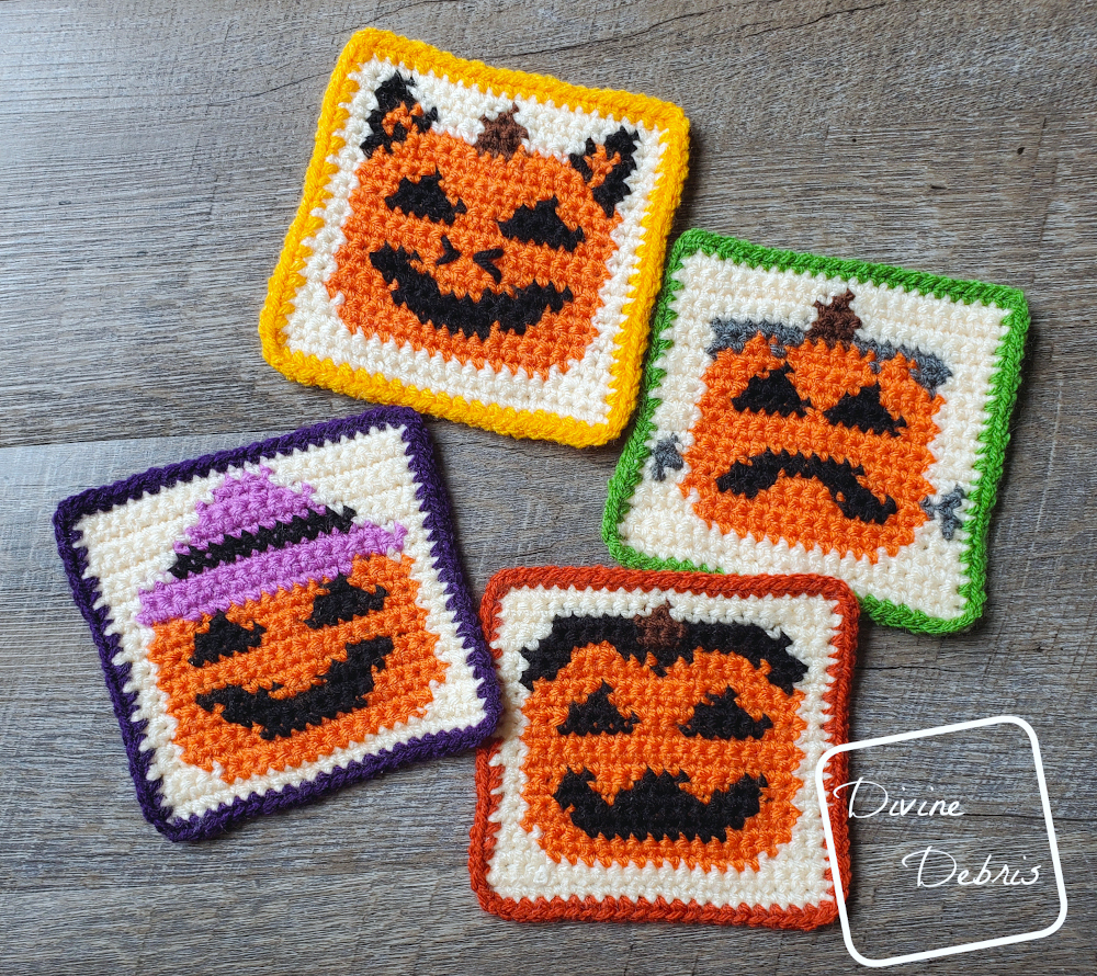 [Image descritption] The four Halloween Pumpkin Coasters crochet patterns lay flat on a wood-grain background.