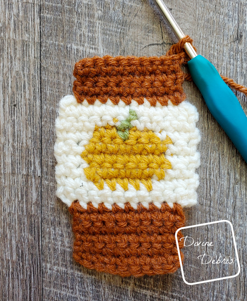 [Image description] Close up photo of the Cozy, Bottom, and Top (sans the Lid) sections of the Pumpkin Spice Latte Earrings/ Applique crochet pattern