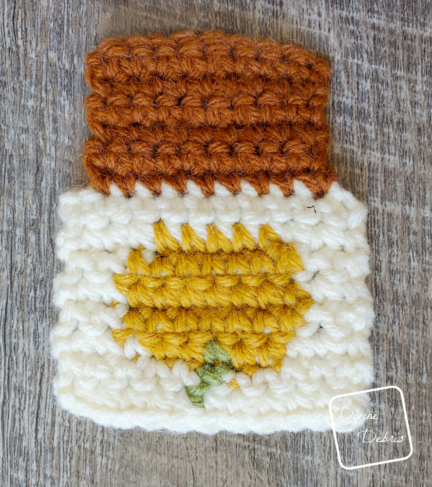 [Image description] Close up photo of the Cozy and Bottom sections of the Pumpkin Spice Latte Earrings/ Applique crochet pattern