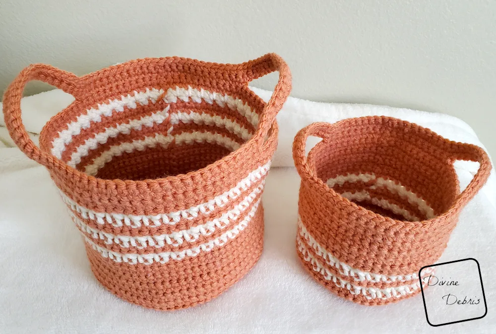 [Image description] A downward look into the Cally Baskets Duo sitting on a white blanket with a tan colored background