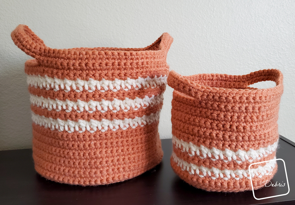 [Image description] The Cally Baskets Duo on a black shelf with a tan colored background