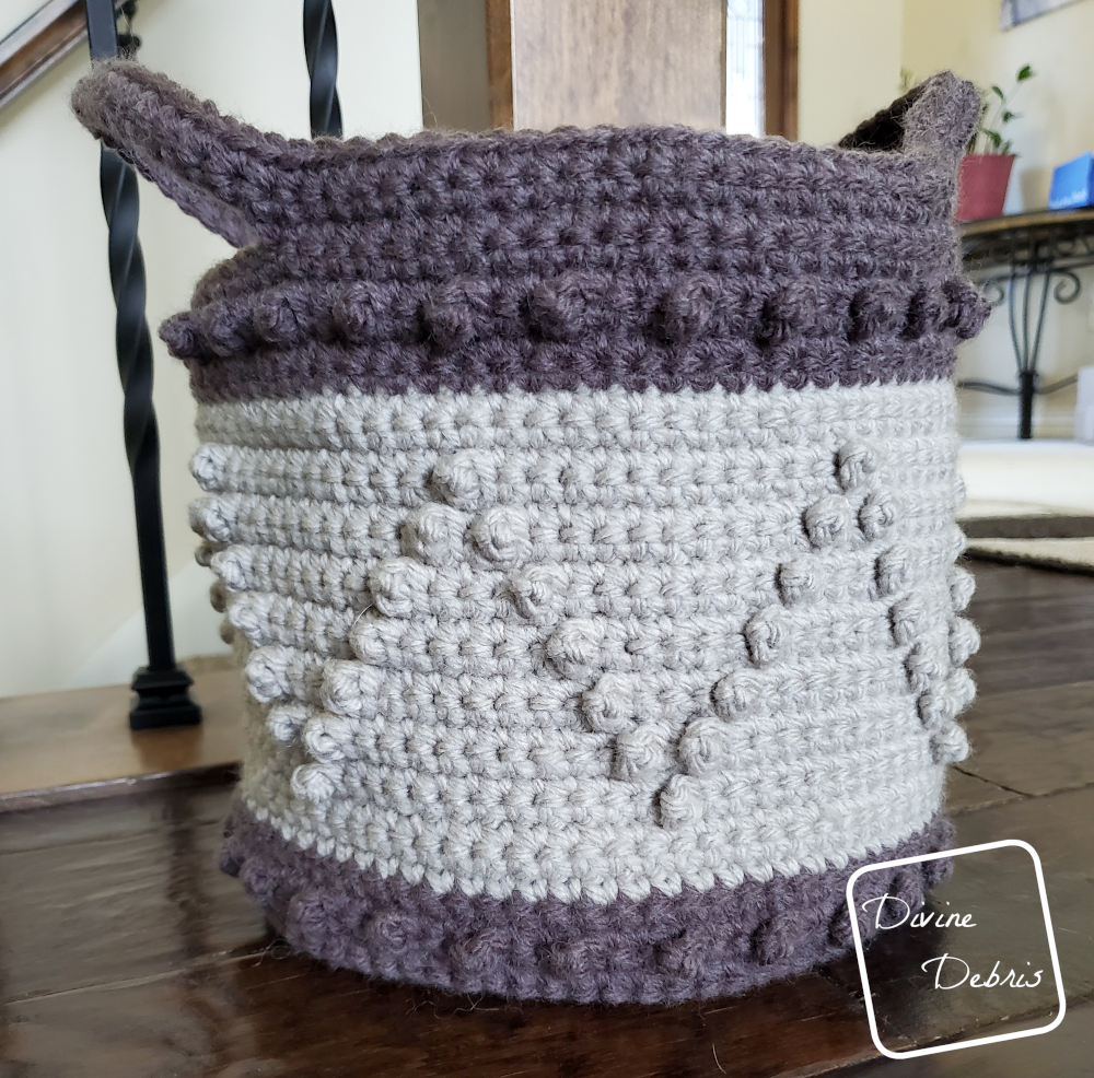 [image description] Photo of the large Berry Stitch Basket close up, sitting on a wood floor