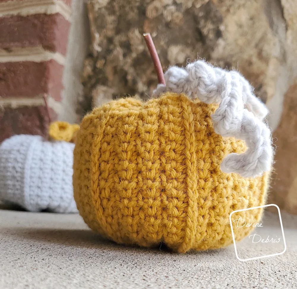 [Image description] Close up of the Keeley Pumpkin in yellow with gray tendrils