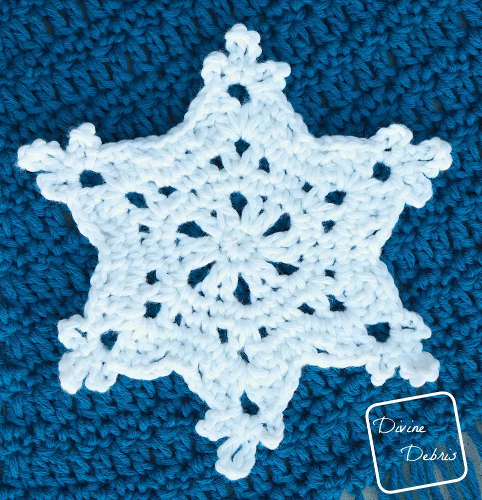 [Image description] Close up of Snowflake Applique 2 of the Crystal Snowflakes Shawl
