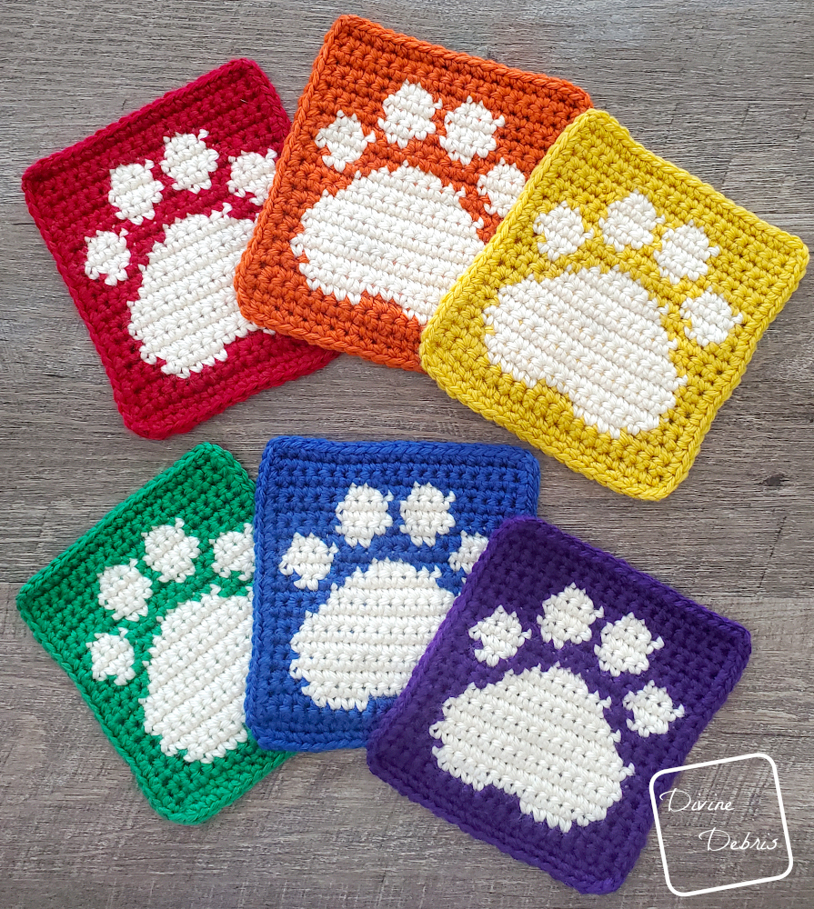 [Image description] Top down look at 6 Cute Paw Print Squares arranged in 2 rows of rainbow colors.