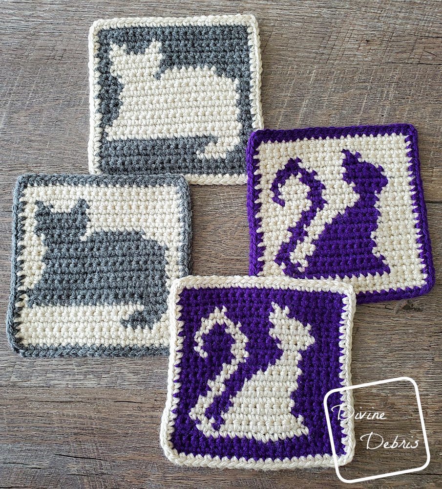 [Image description] Top down view of the Cute Cats Squares crochet coasters on a wood grain background.