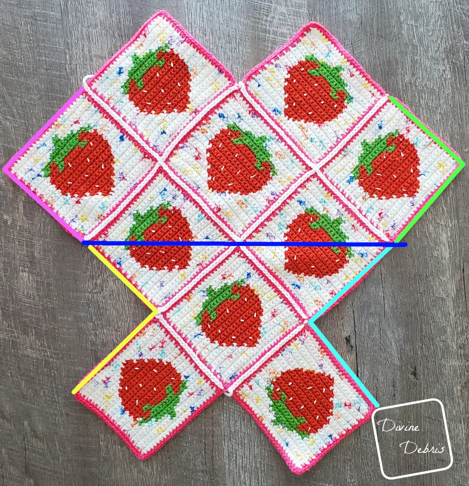 [Image description] Cute Strawberry Bag assembly photo 2 - all 10 squares are seamed and are laying on an fake wood background, color coded for where to seam next.