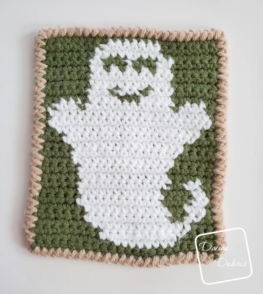 [Image description] Top down look of the wrong side of the green and white Cute Ghost Coaster crochet pattern.