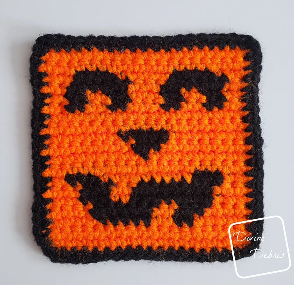 [Image description] Top down view of the Jack O'Lantern Halloween Square on a white background