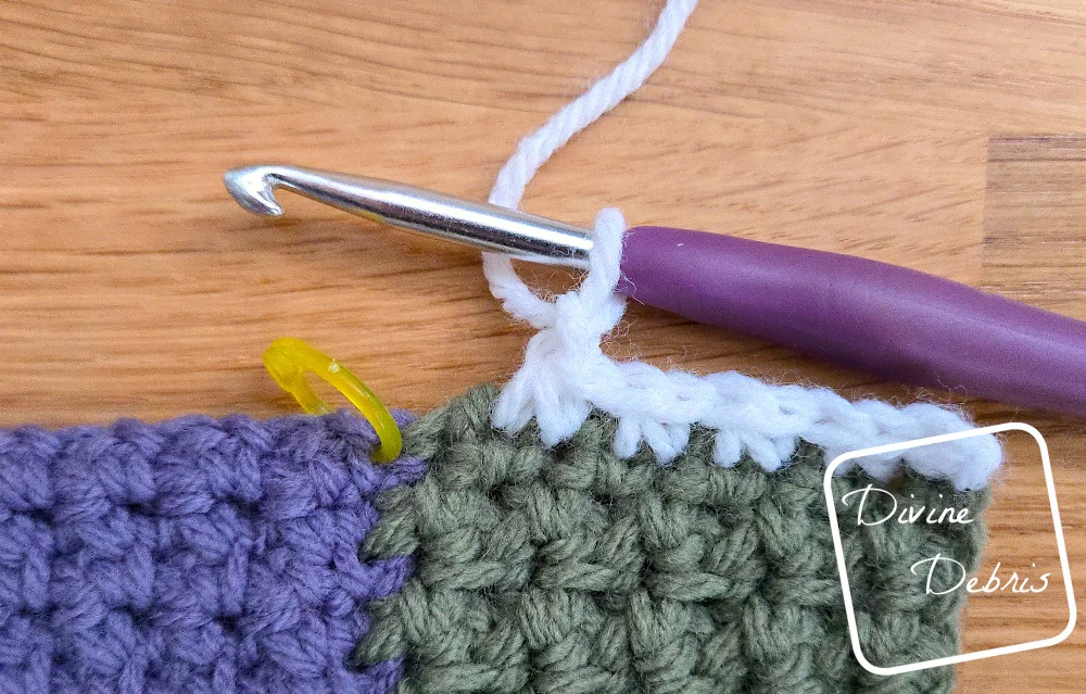 [Image description] Close up of where to place the parts of the scc on the Mountain Log Cabin Blanket.