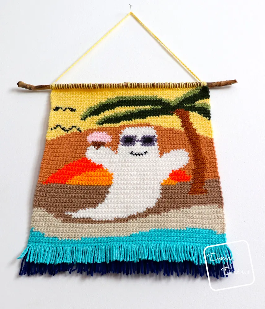 [Image description] An angled view of the Beach Ghost Wall Hanging, focusing on the fringe at the bottom of the photo.
