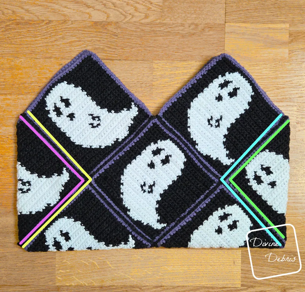 [Image description] Gwendoline Ghost Bag assembly photo 2 - all 13 squares are seamed and are laying on an wooden background, color coded for where to seam next.