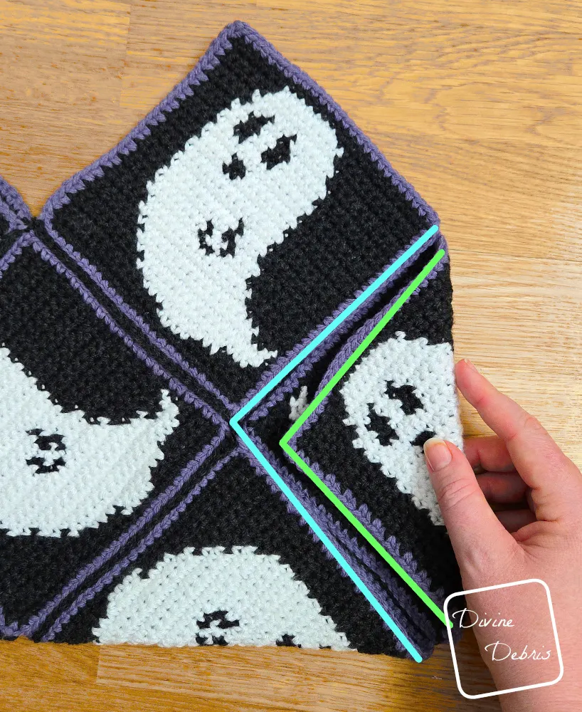 [Image description] Gwendoline Ghost Bag assembly photo 4 - close up on how to fold the right-hand side.