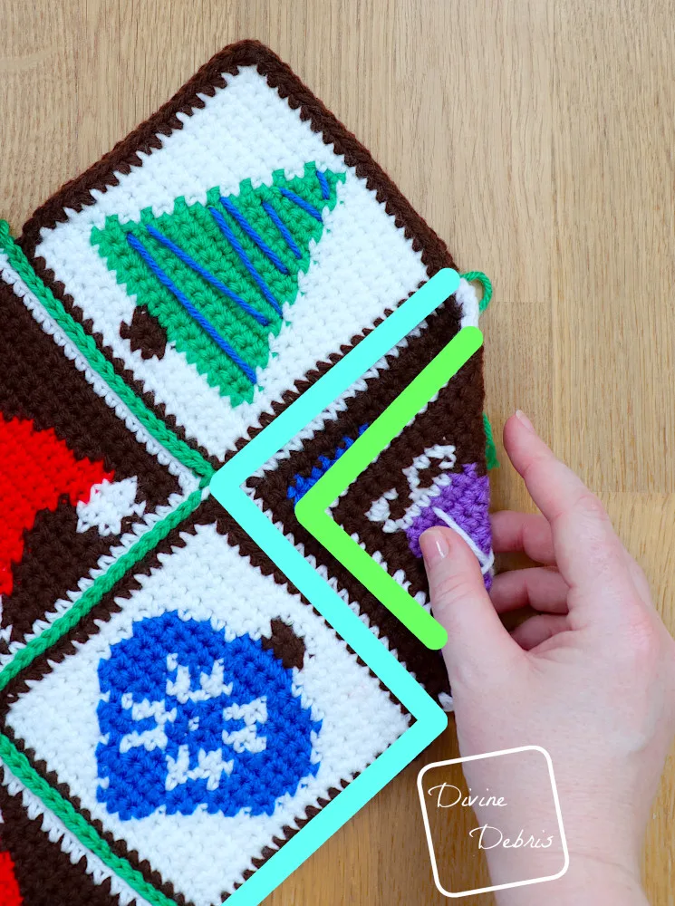 [Image description] Patchwork Christmas Bag assembly photo 4 - close up on how to fold the right-hand side.